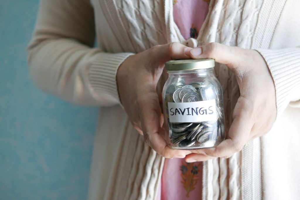 A jar with a tag that says "savings"